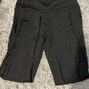 Ankle length leggings with a flower design from the ankle to the hip